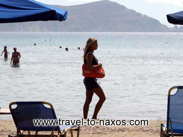 GIRL ON THE BEACH - A beautiful girl walking on Agios Georgios beach