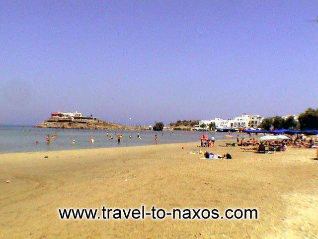 Agios Georgios beach lies exactly next to Naxos Chora.  